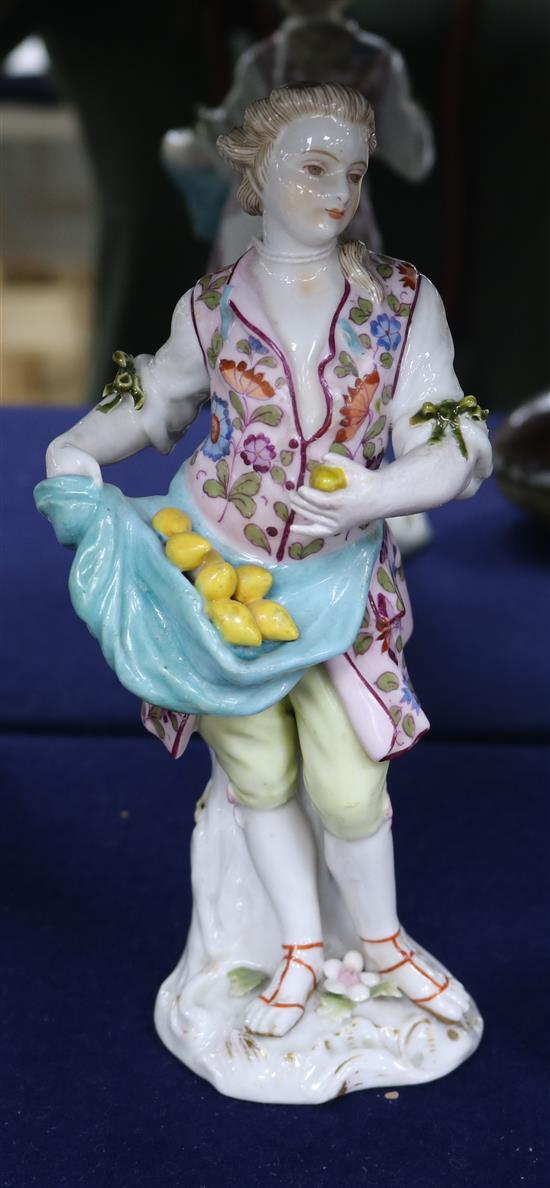 A 19th century German porcelain figure of a lemon seller (arm restored)